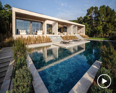 ARK architects elevates villa tai on stone podium framing views of mediterranean sea