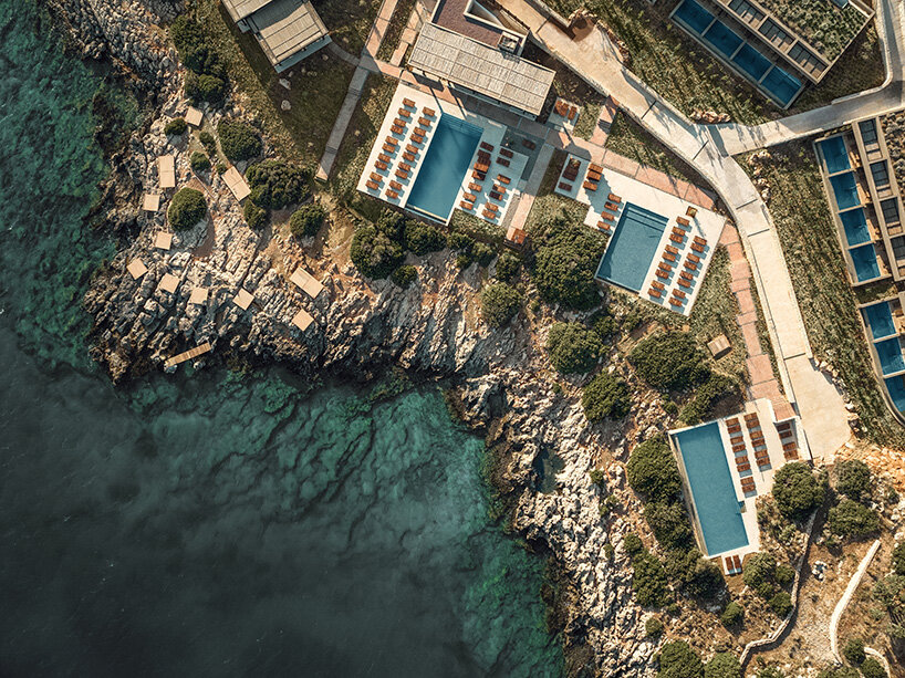 block722 sculpts JW marriott's crete resort into the landscape using stone from the site