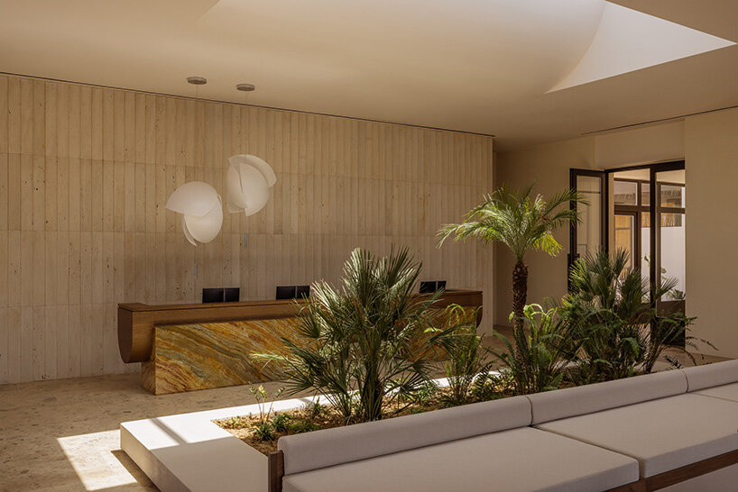 block722 sculpts JW marriott's crete resort into the landscape using stone from the site