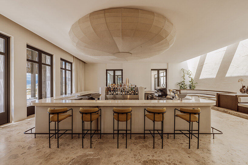 block722 sculpts JW marriott's crete resort into the landscape using stone from the site