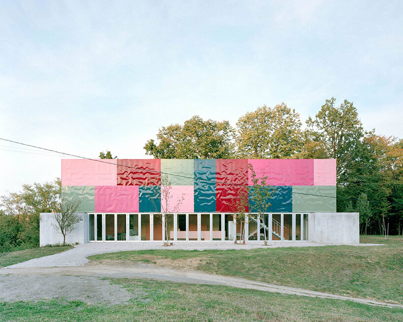 vivid rippled panels envelop TEN's care-based housing for women in bosnia-herzegovina