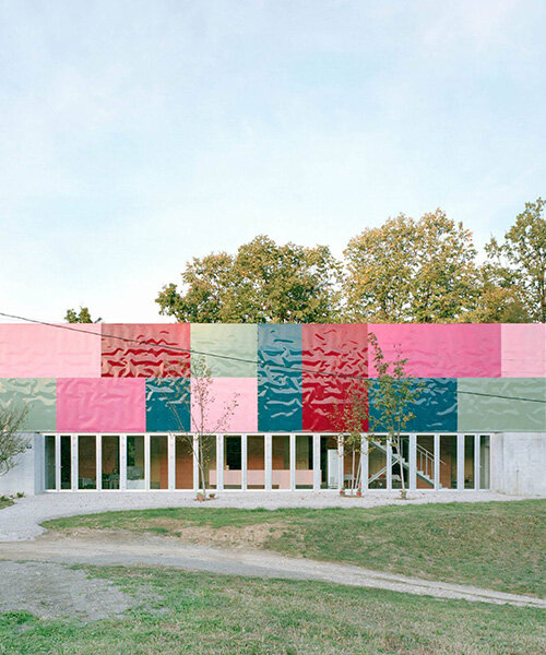vivid rippled panels envelop TEN's care-based housing for women in bosnia-herzegovina
