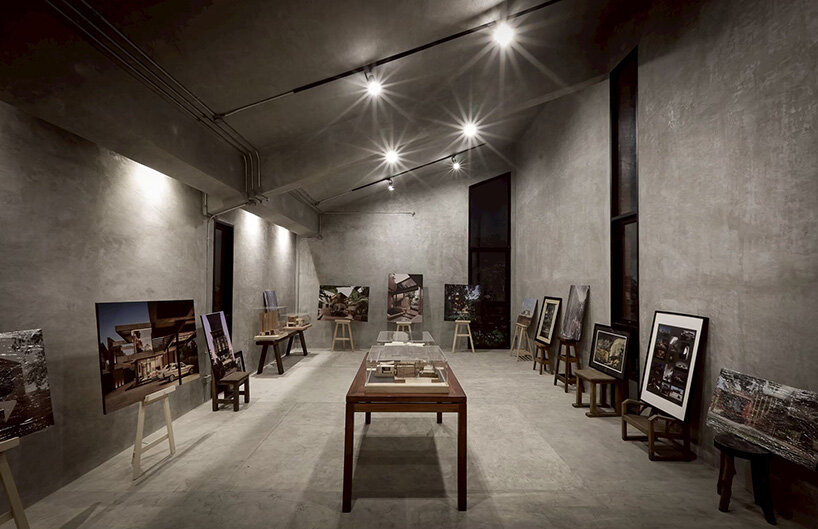 curved brick wall envelops volume matrix studio's multi-functional art space in bangkok