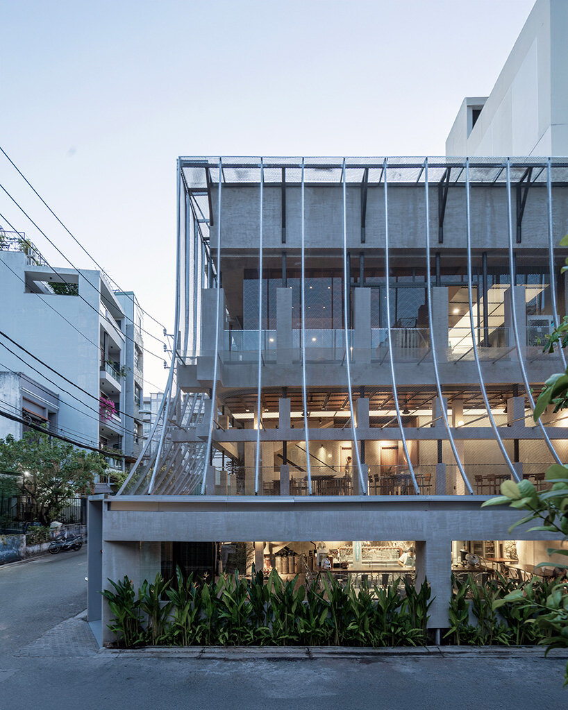 perforated metal veil by KHOA VU transforms old vietnamese villa into breathable restaurant
