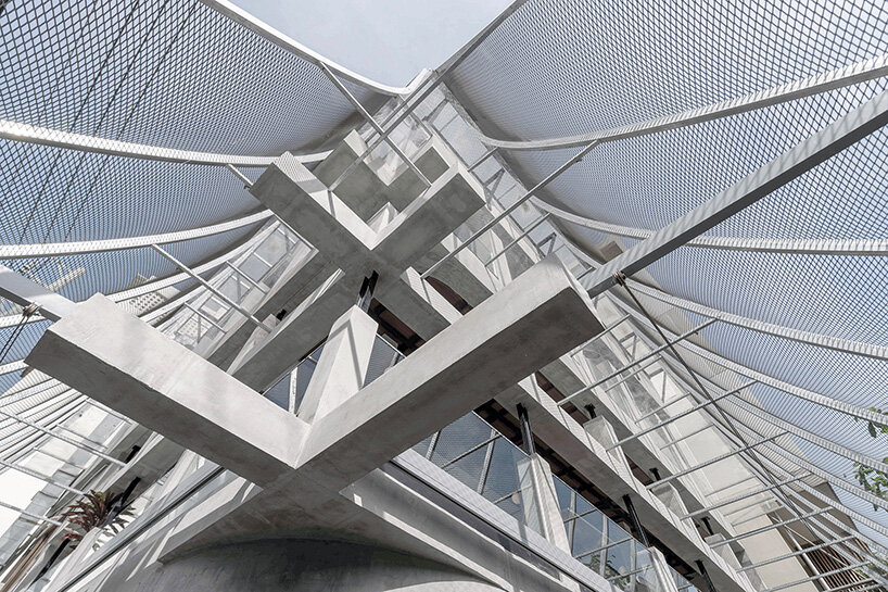 perforated metal veil by KHOA VU transforms old vietnamese villa into breathable restaurant