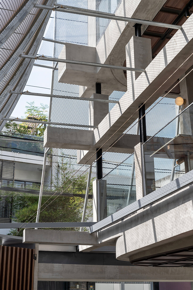 perforated metal veil by KHOA VU transforms old vietnamese villa into breathable restaurant