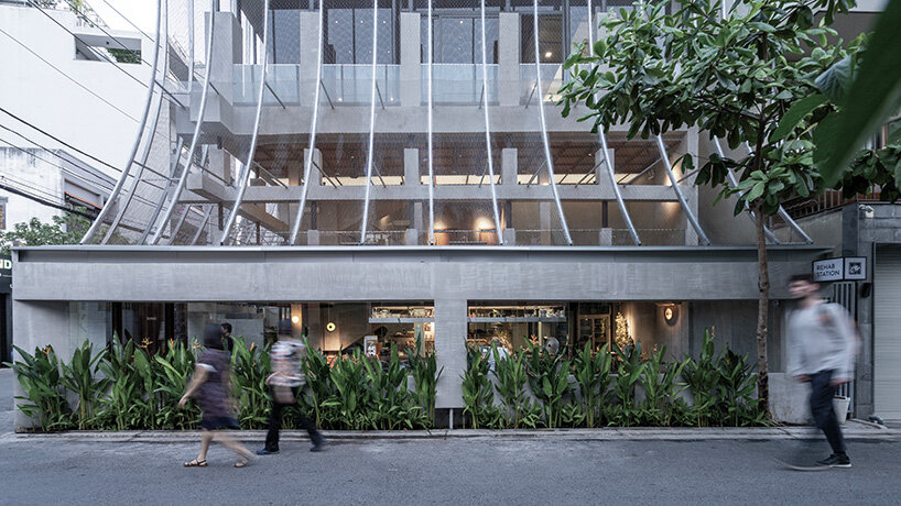 perforated metal veil by KHOA VU transforms old vietnamese villa into breathable restaurant