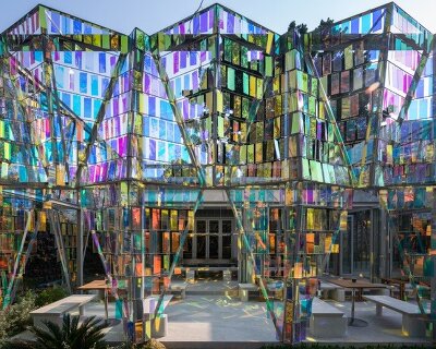 iridescent panels evoke gemstones at BBWORKSPACE’s thai café, refracting shifting hues