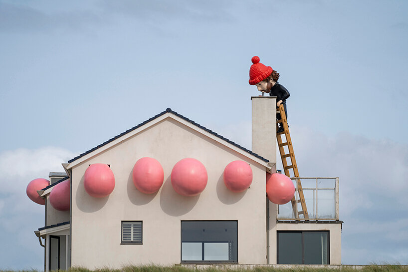 frankey blows giant bubble that breaks through windows in latest rooftop sculpture