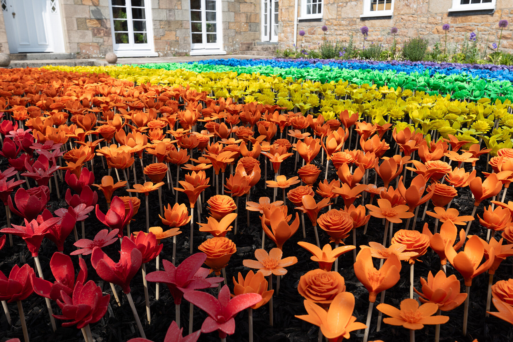 glowing meadow of 3D printed flowers by stuart semple takes over jersey zoo in the UK