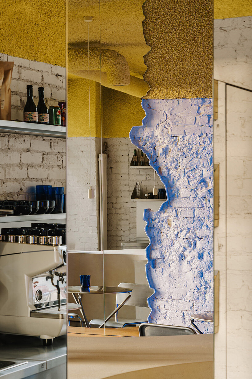 golden ceiling foams above reef-shaped counter in warsaw bakery by znamy się