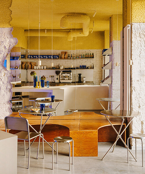 golden ceiling foams above reef-shaped counter in warsaw bakery by znamy się