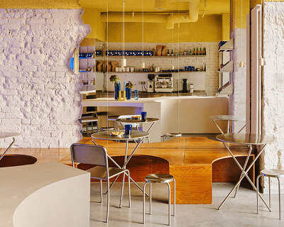 golden ceiling foams above reef-shaped counter in warsaw bakery by znamy się