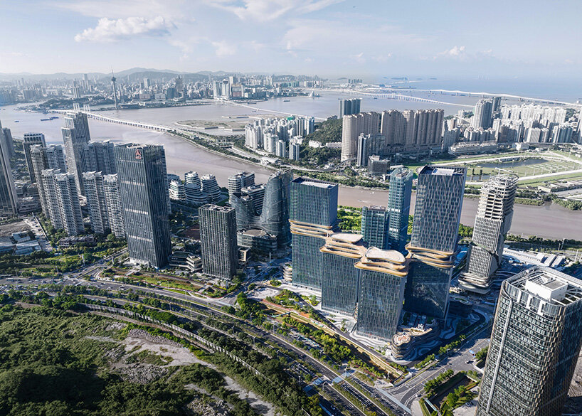 golden sky bridge by aedas stitches together towers with its looping shape in china