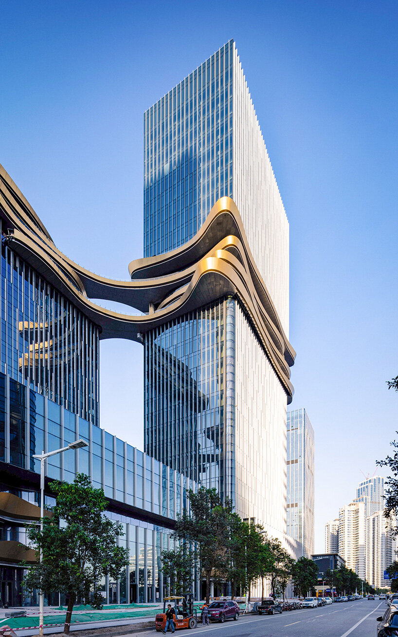 golden sky bridge by aedas stitches together towers with its looping shape in china