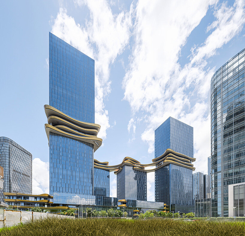 golden sky bridge by aedas stitches together towers with its looping shape in china