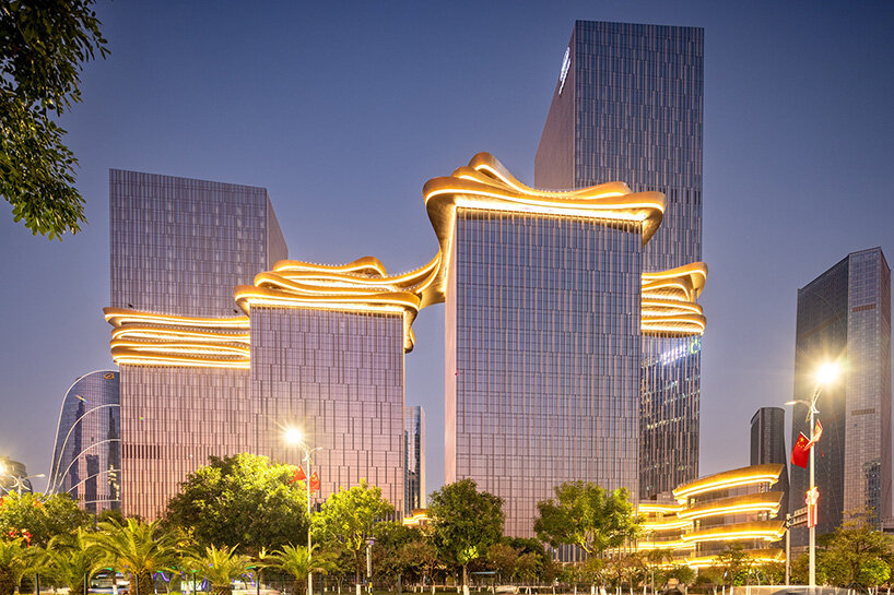 golden sky bridge by aedas stitches together towers with its looping shape in china