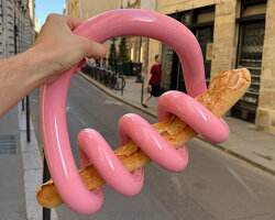 gustaf westman’s spiral baguette holder carries a loaf of bread like a handbag