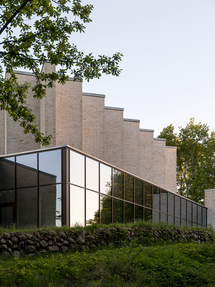 henning larsen builds brick-clad church in denmark as open pavilion for gathering