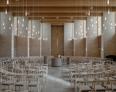 henning larsen builds brick-clad church in denmark as open pavilion for gathering