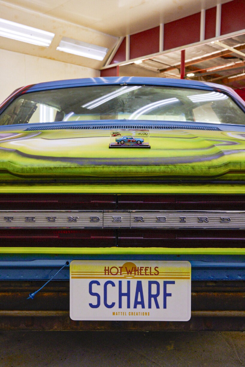 the 1:64 die-cast version on top of the real-life 1967 Ford Thunderbird