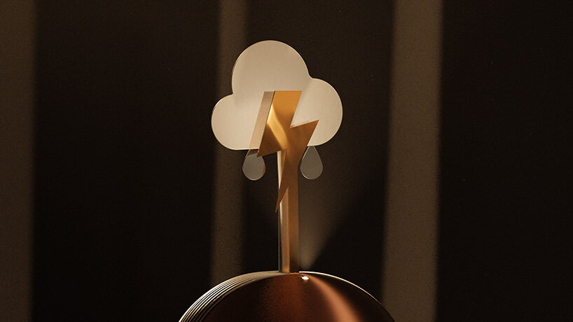 kinetic device by gustav rosén reflects sky conditions with metal weather symbols