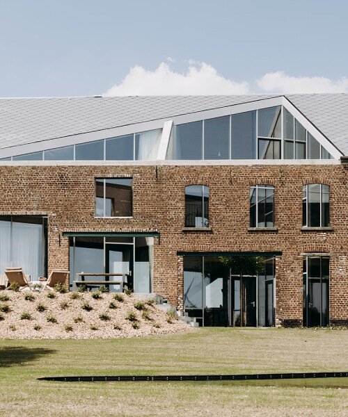 OYO architects carves triangular incision into belgium farmhouse to form luminous courtyard