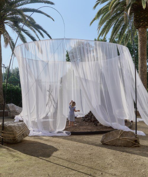 translucent drapes encircle forest floor for nami nami's concéntrico installation in spain