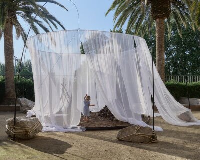 translucent drapes encircle forest floor for nami nami's concéntrico installation in spain