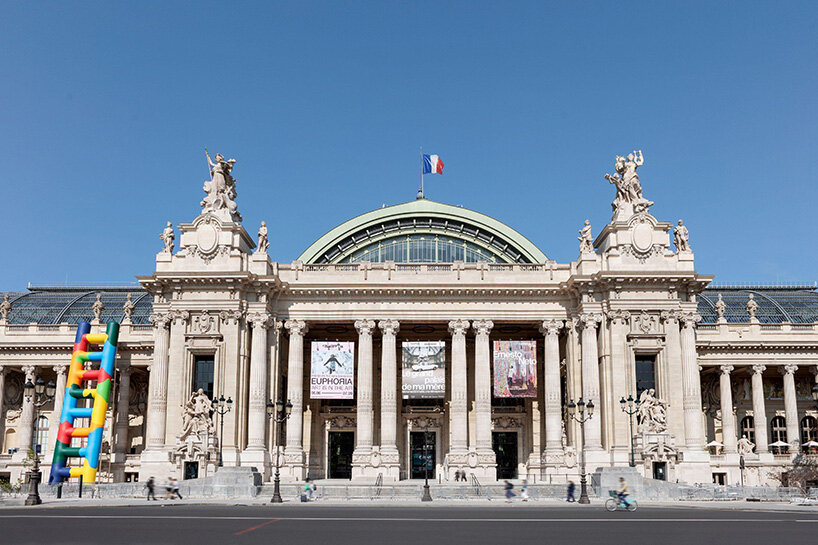 paola pivi leans 20-meter technicolor ladder against the grand palais in paris