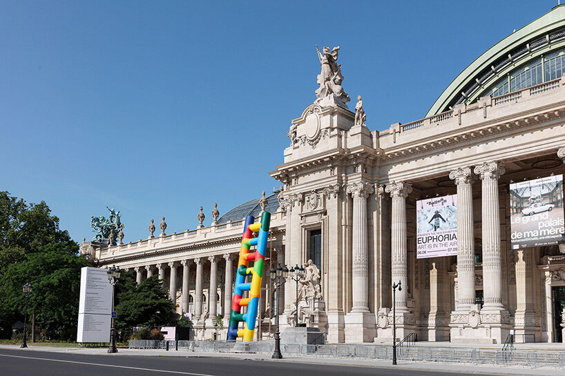 paola pivi leans 20-meter technicolor ladder against the grand palais in paris