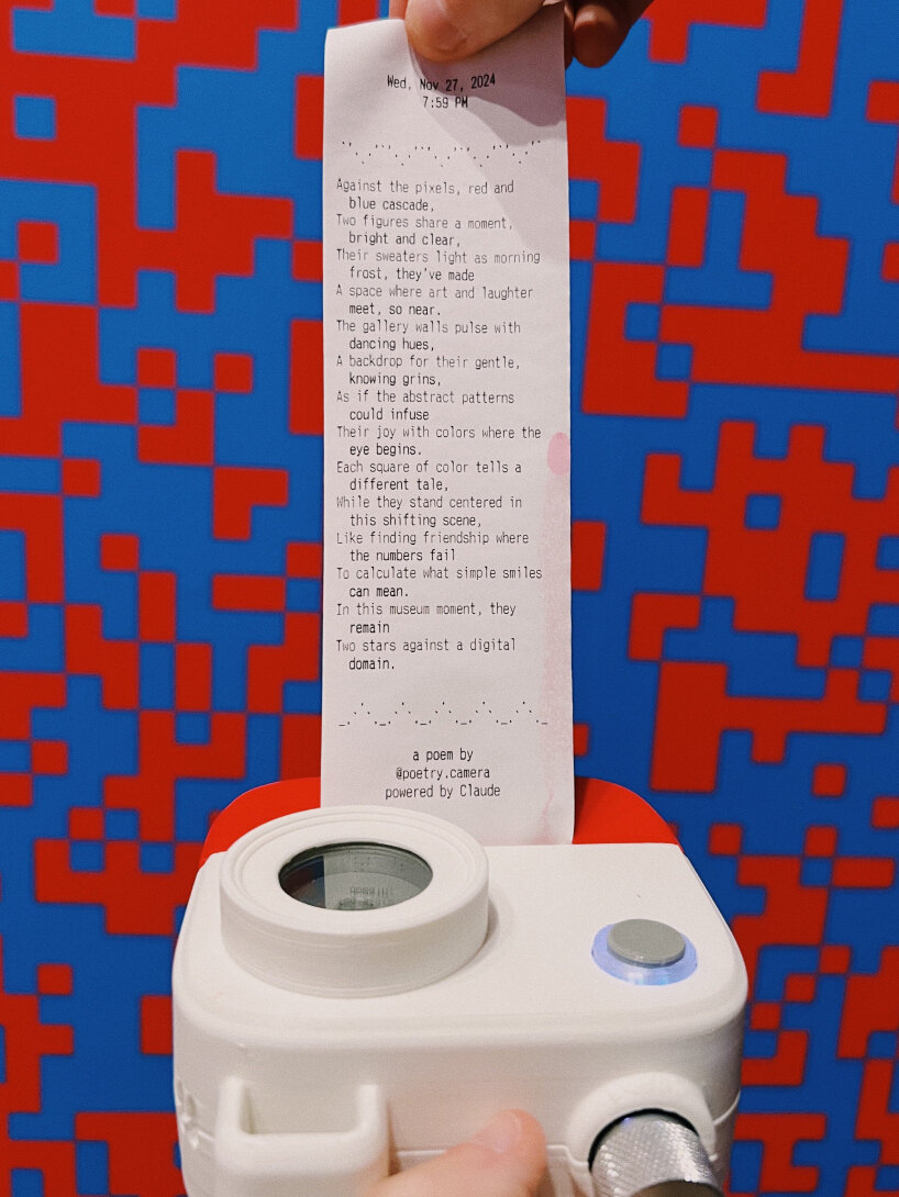 view of the poem printed on a receipt-like paper | photo by Sam McAllister / Anthropic