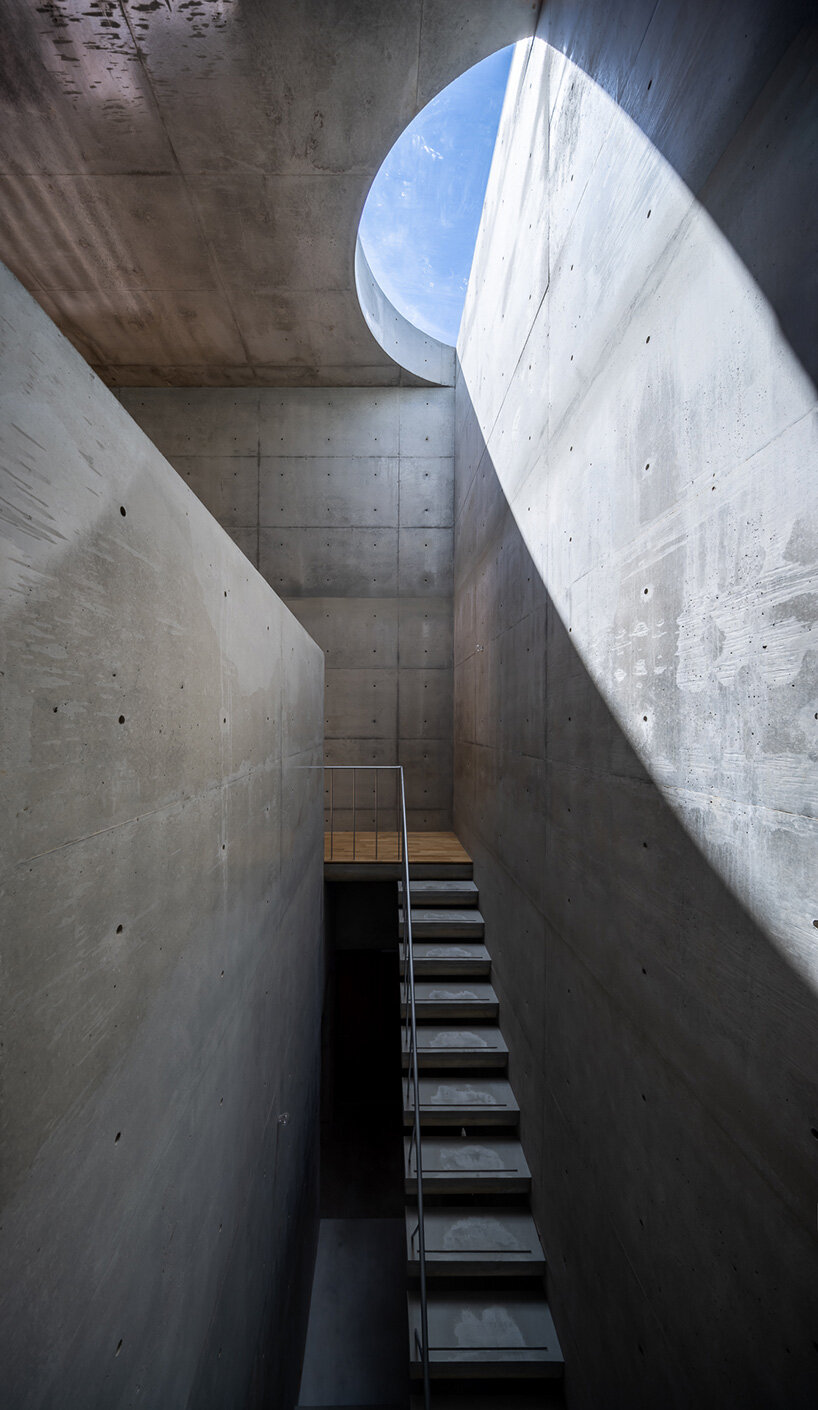 skylights illuminate concrete residence by takeshi hosaka in