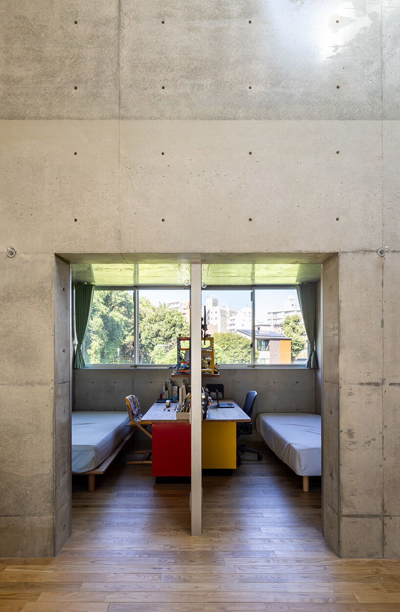 semicircular skylights cast sunbeams across takeshi hosaka's concrete residence in tokyo