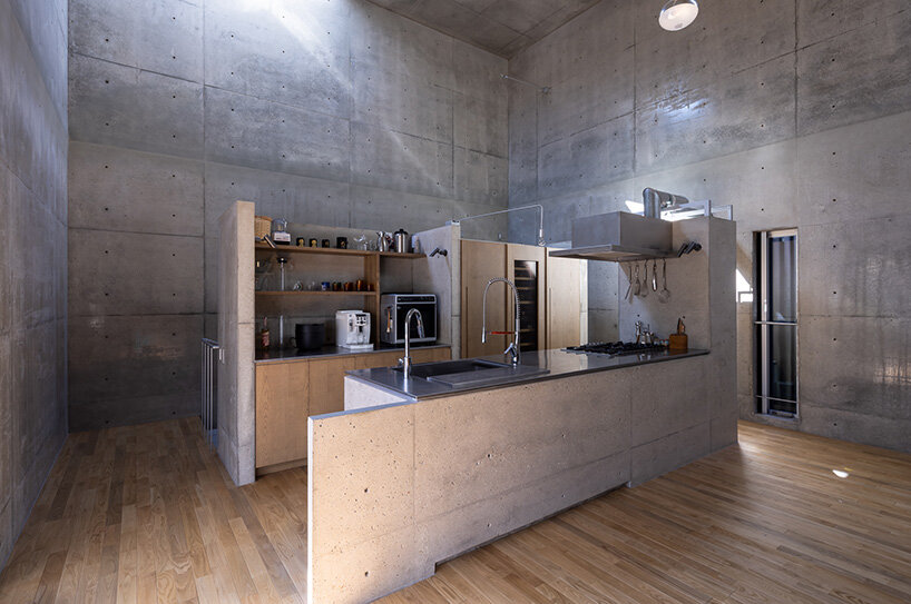 semicircular skylights cast sunbeams across takeshi hosaka's concrete residence in tokyo