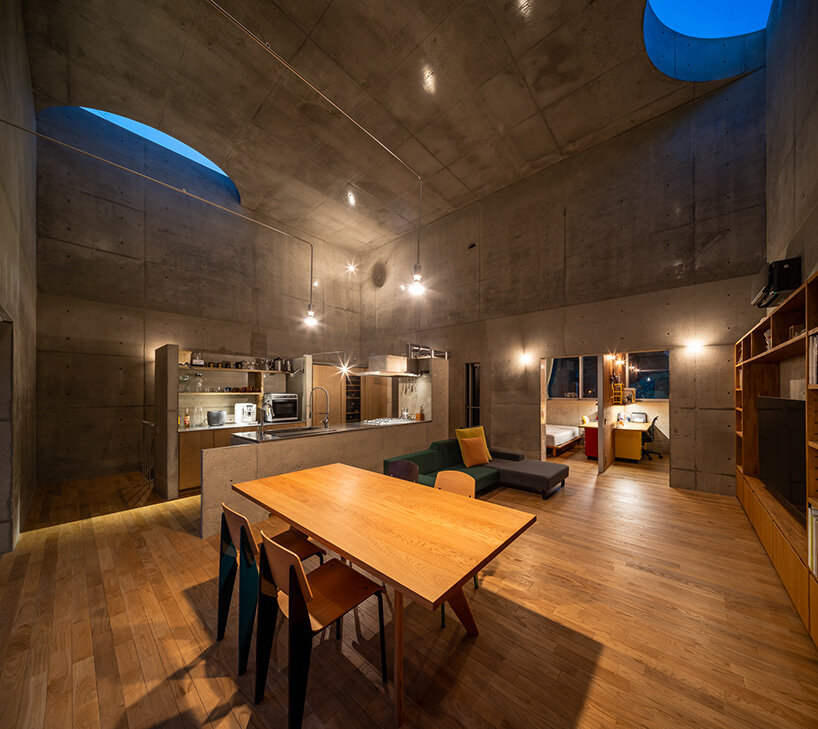 semicircular skylights cast sunbeams across takeshi hosaka's concrete residence in tokyo