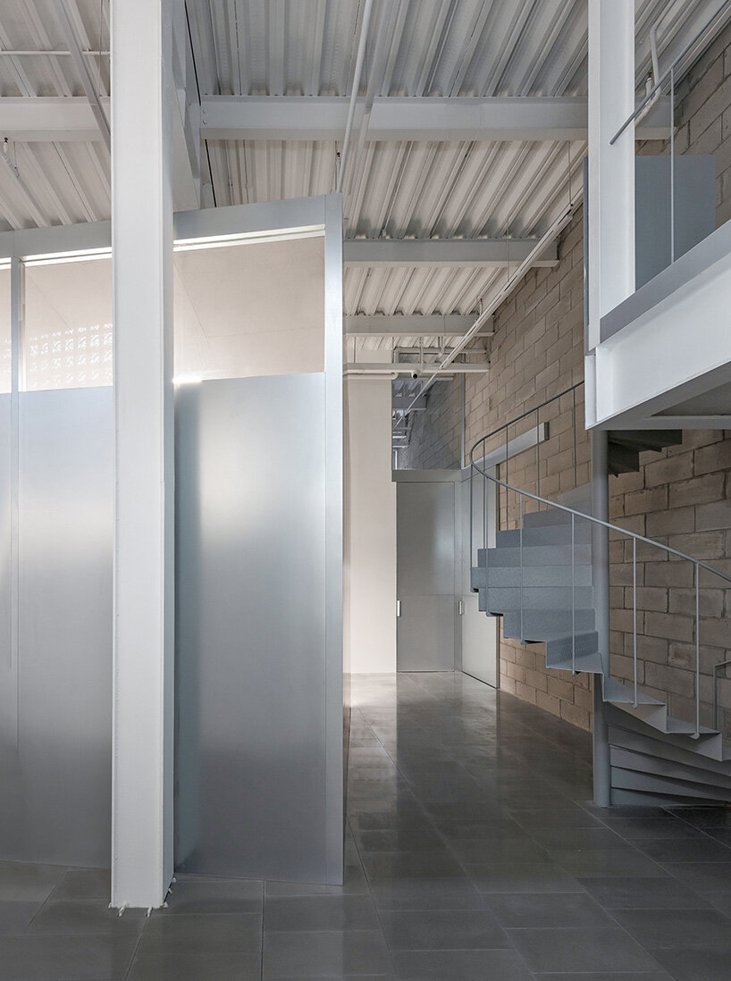 The bent inclined meeting room The Shanghai Office Revamp by Workshop Siyu