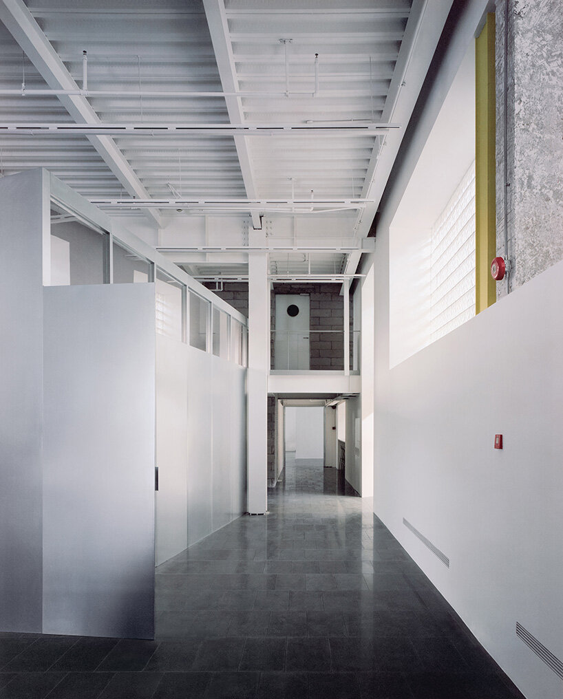 skewed meeting room bends the grid in shanghai office revamp by atelier siyu