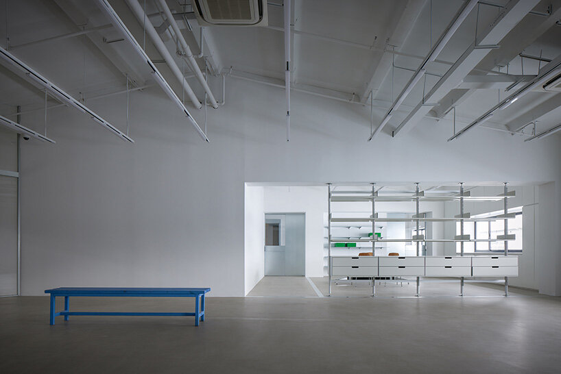 skewed meeting room bends the grid in shanghai office revamp by atelier siyu