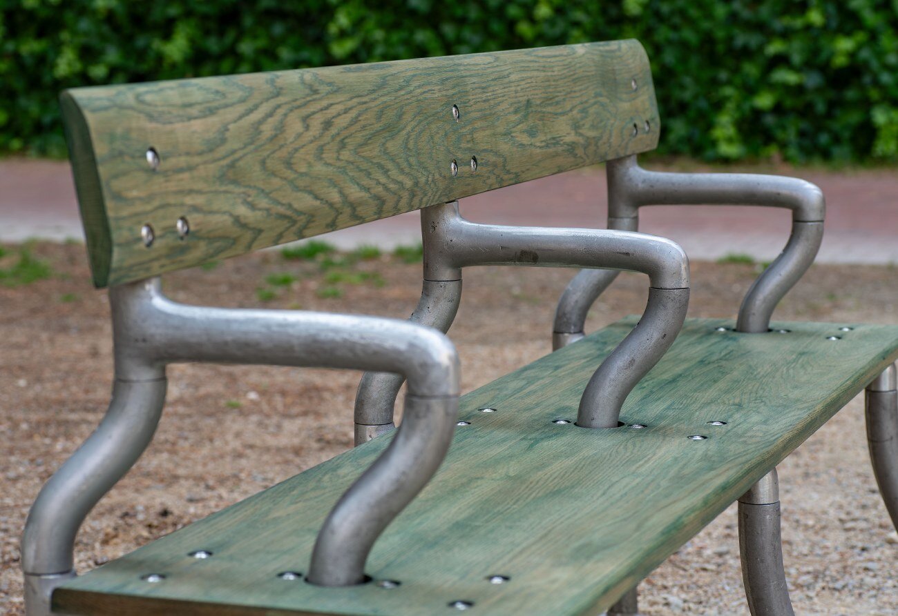 soft baroque's kinetic bench in spanish plaza sways and twists when you sit on it