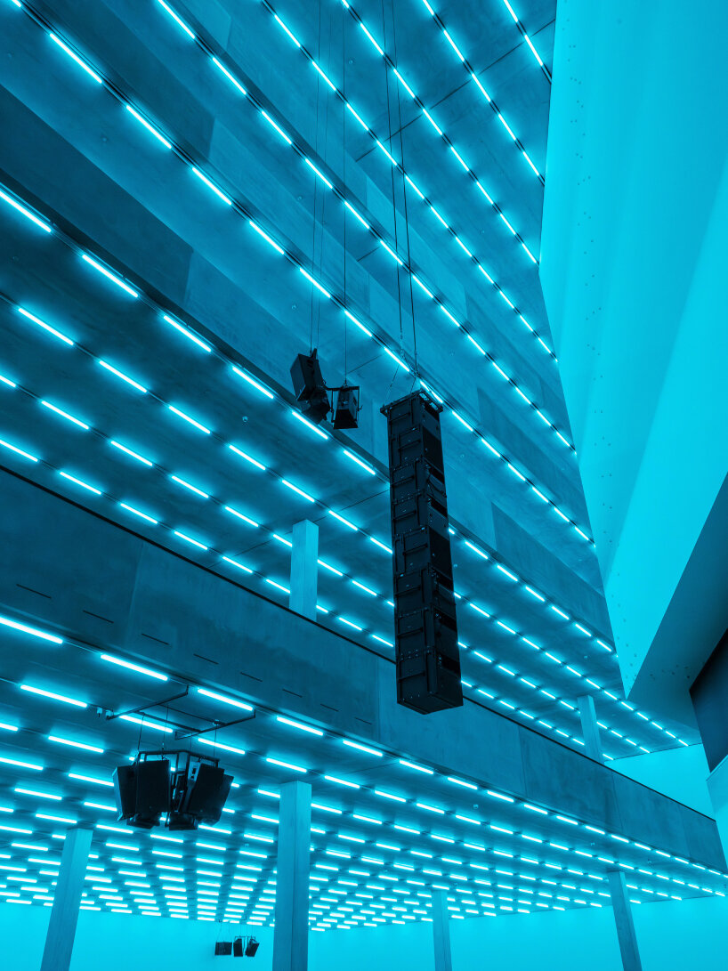 the light tubes span across the building’s five levels, including the soaring atrium