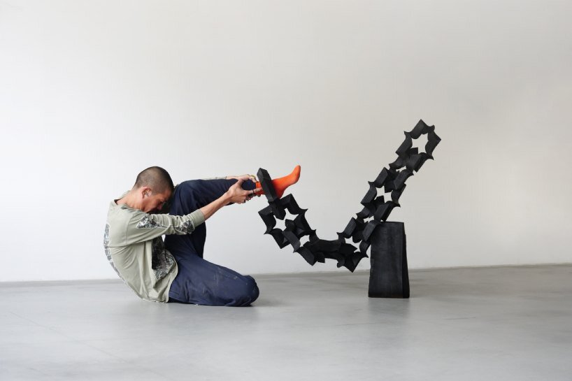 takuto ohta slices into japanese cedar to create sculptural tension for asymptotic wood series