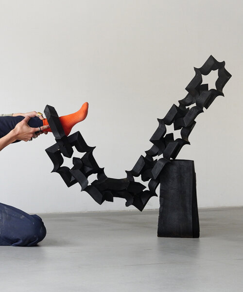 takuto ohta slices into japanese cedar to create sculptural tension for asymptotic wood series