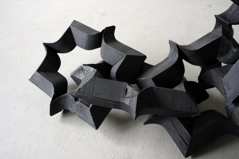 takuto ohta slices into japanese cedar to create sculptural tension for asymptotic wood series