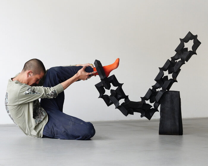 takuto ohta slices into japanese cedar to create sculptural tension for asymptotic wood series