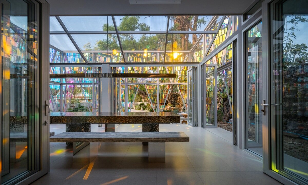 iridescent panels evoke gemstones at BBWORKSPACE’s thai café, refracting shifting hues