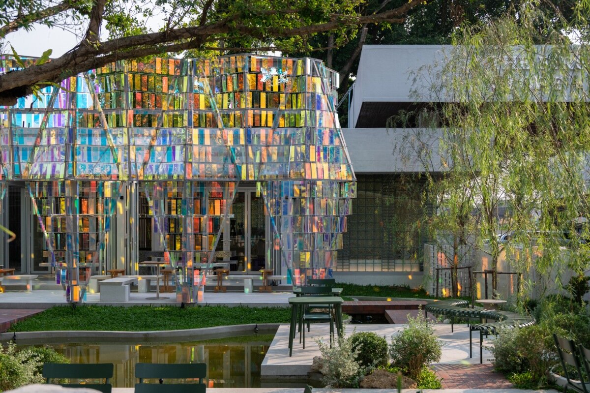 iridescent panels evoke gems at BBWORKSPACE's thailand café