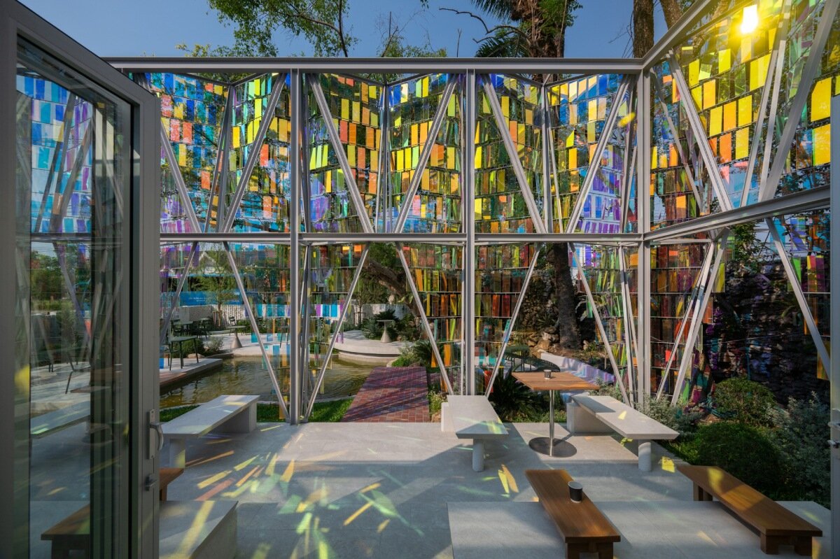 iridescent panels evoking gemstones refract shifting hues at BBWORKSPACE’s thailand café