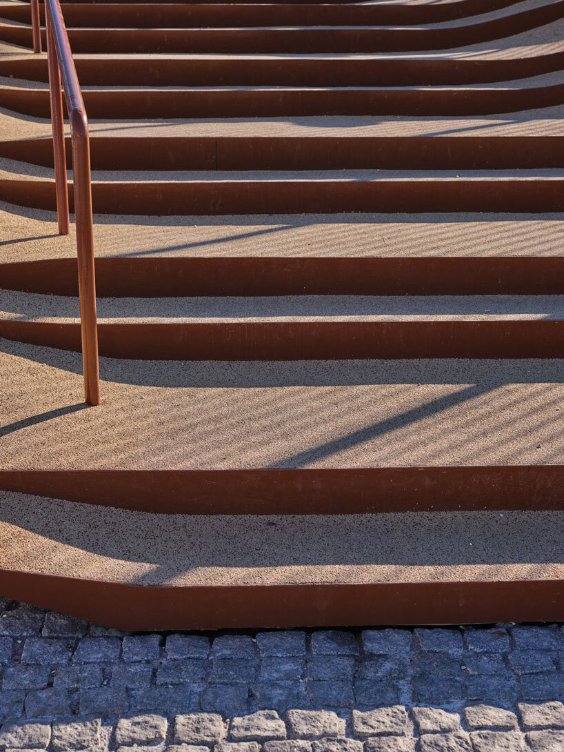 slender steel bridge with integrated net seating expands over foša port in croatia