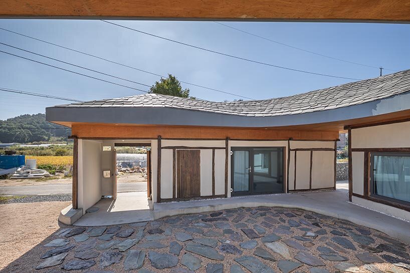 undulating roof crowns 50-year-old farmhouse renovation by drawing works in korea